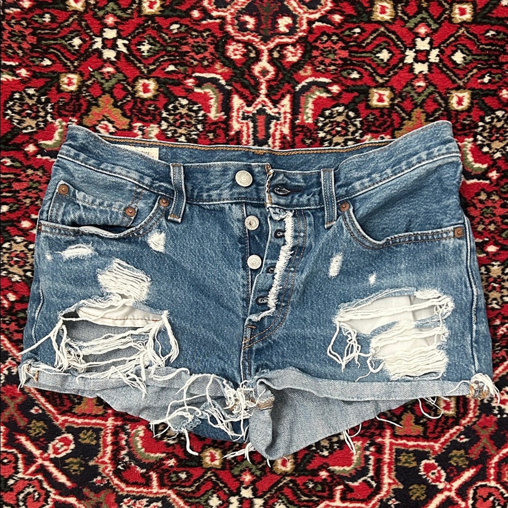Levi’s 501
Distressed High-Waist Blue Denim shorty Shorts with button fly